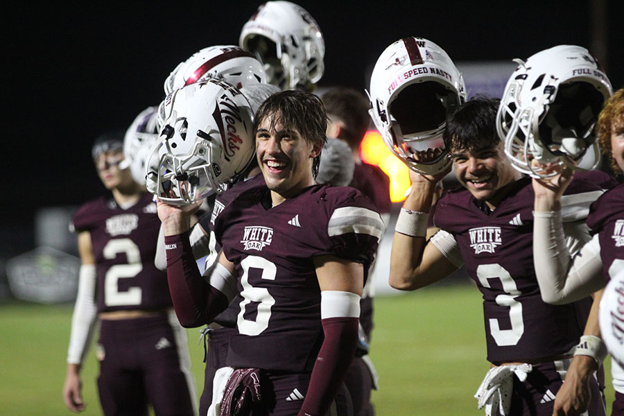 Seniors Cameron Venable and Logan Ladwig celebrate a decisive victory over the Queen City Bulldogs.