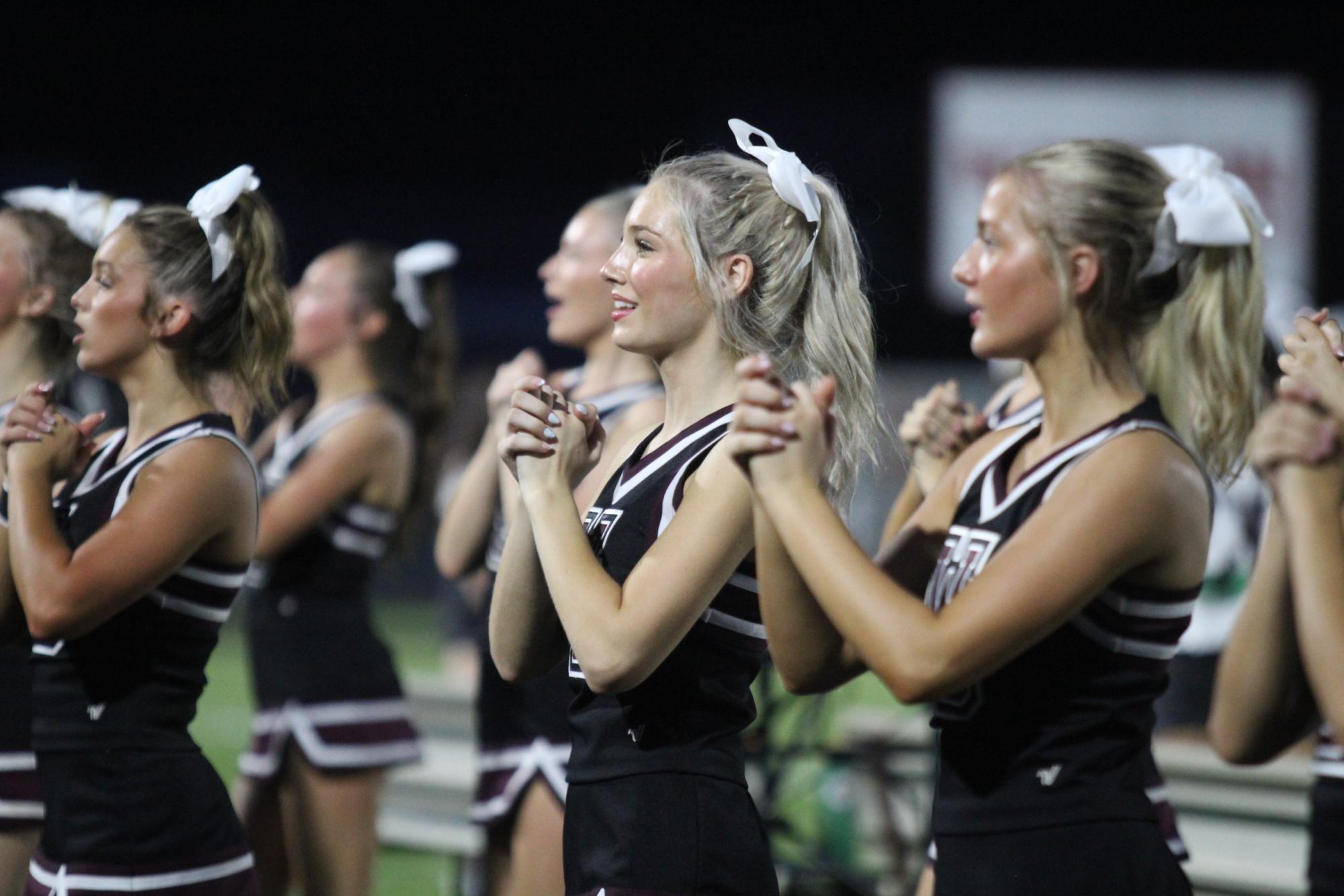Senior Addi Saccoccio cheers for the Roughnecks against the Paul Pewitt Brahamas. The Roughnecks won 30-26. 