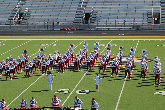 The band stands at parade rest before beginning their drill at the Region 4 Military Marching Competition on Oct. 21 in Mt. Pleasant.