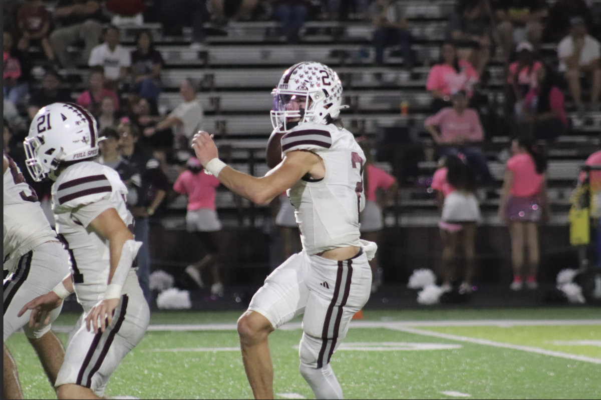 Senior quarterback Jaxsen Ludlow scans the field for an open receiver against Jefferson. 